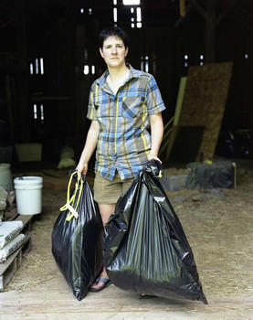 Suzi carrying bags of fleece